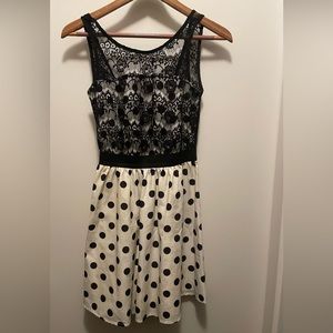 Short black lace dress with open back